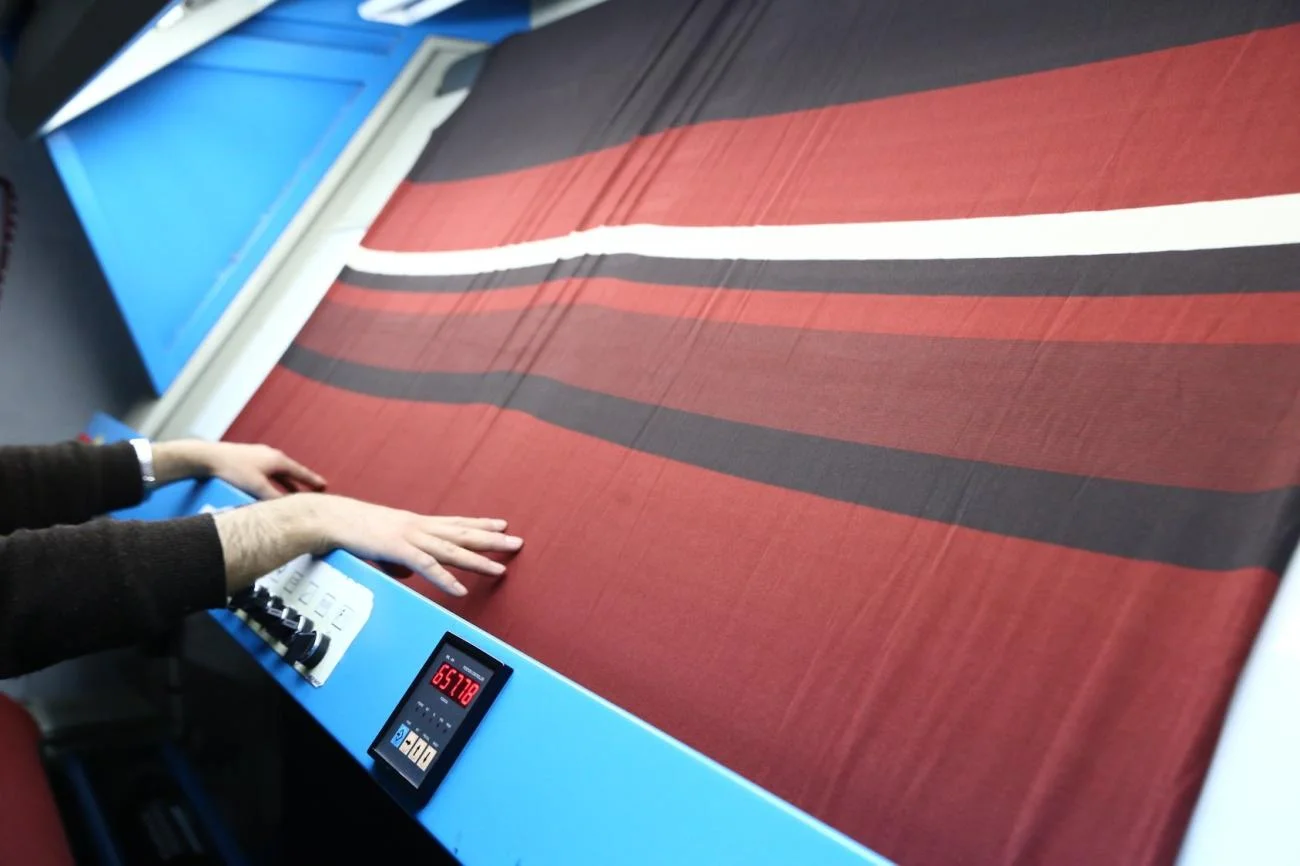 Agent / agente de finition habillement